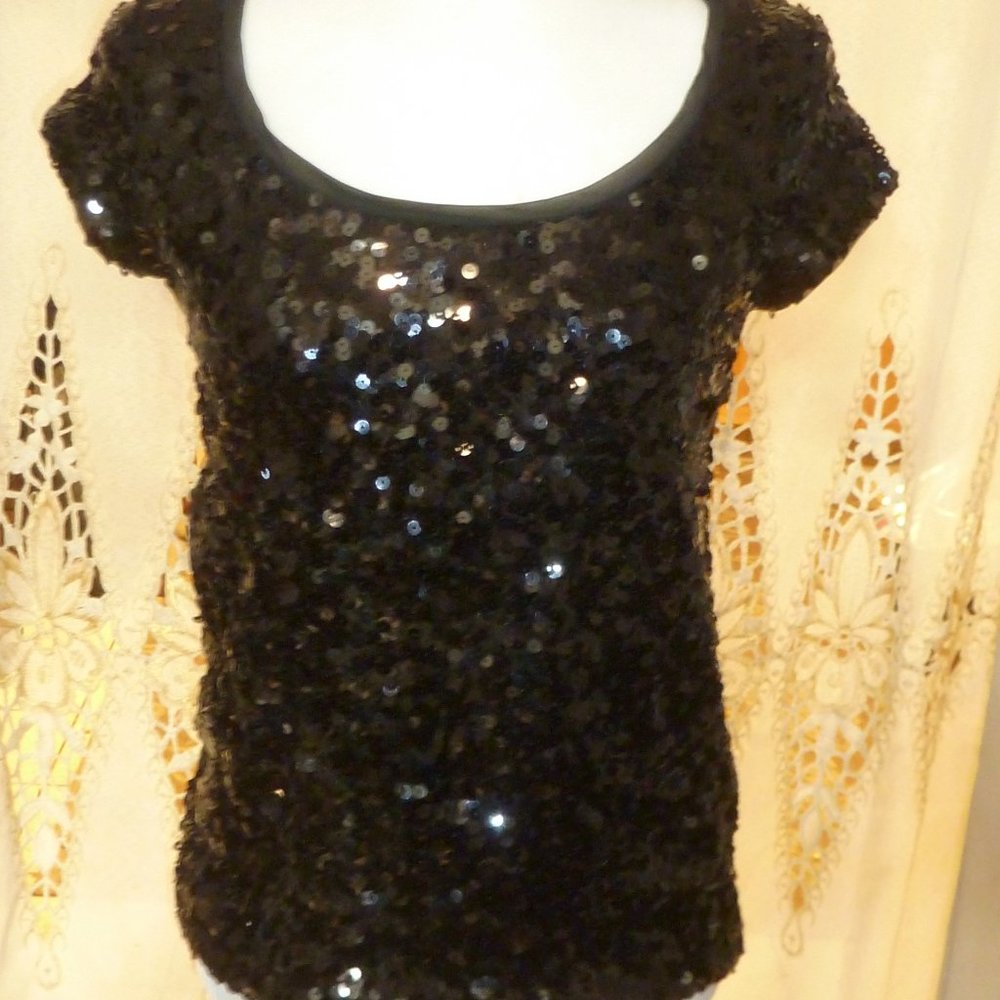 Get ready to shine all night long in Black short sleeve Sequin top Sz S